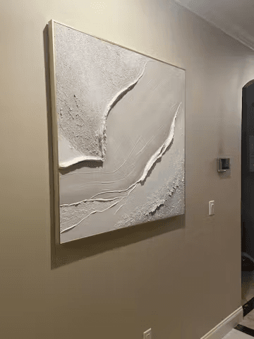 White dimensional texture painting installed in a hallway