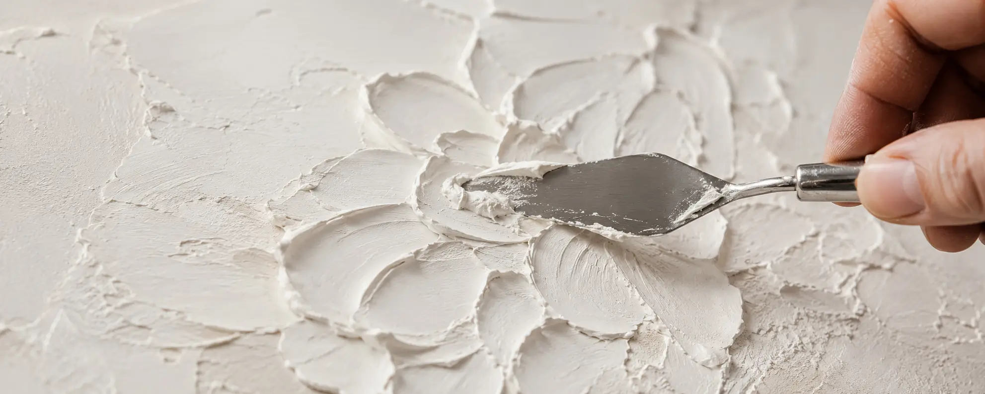 Close-up of handcrafted wall art texture in production