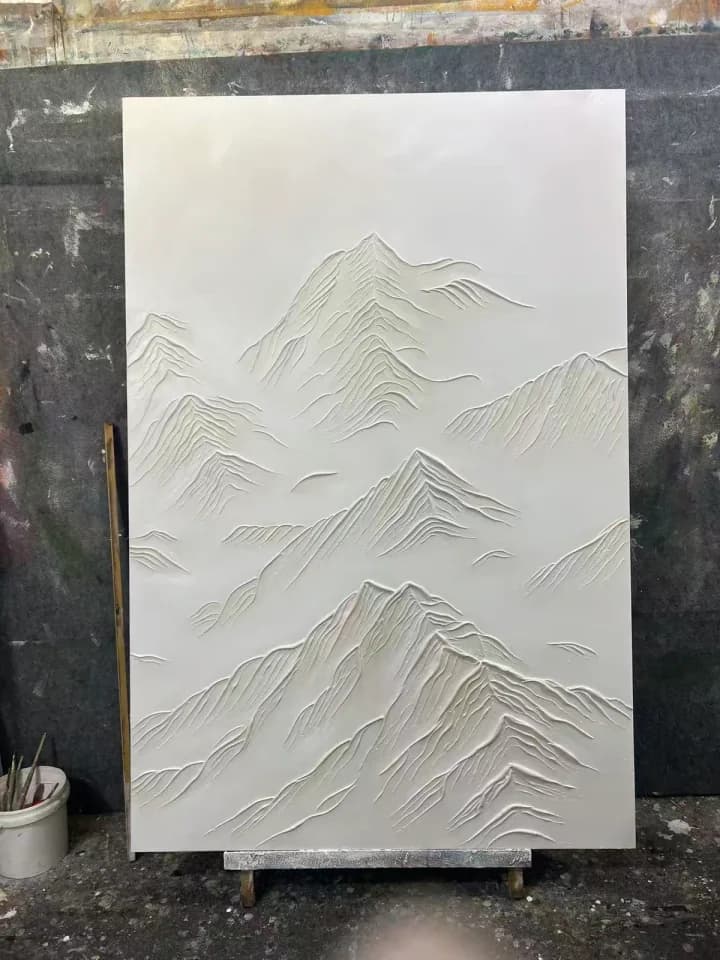 White mountain relief artwork completed by hand