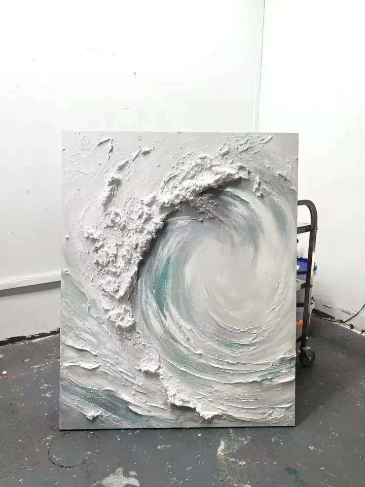 Raised white wave artwork photographed after texture finishing