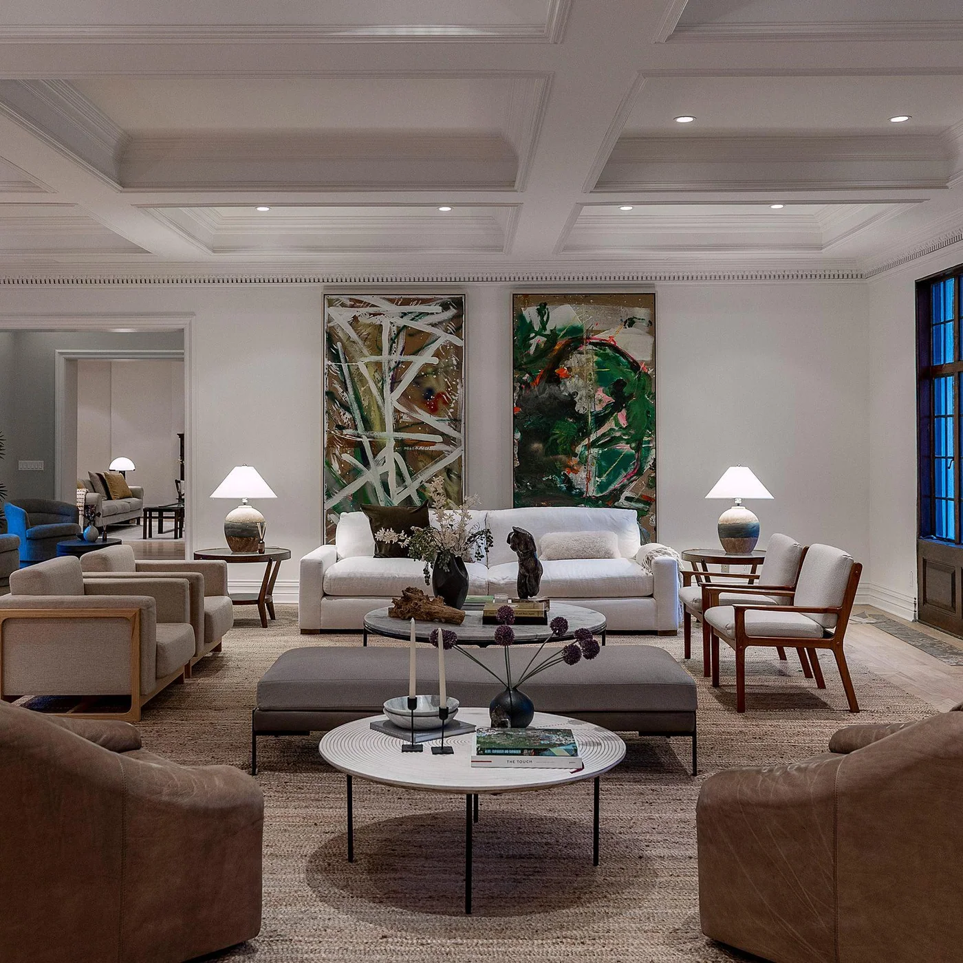 Two large abstract paintings installed in a luxury Beverly Hills living room